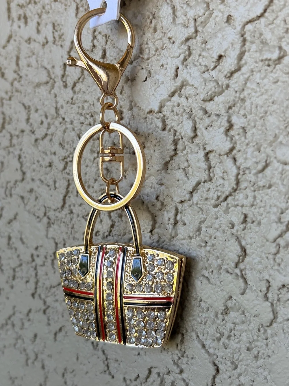 Sparkling Gold Crystal Tote Bag Keychain with Red & Black Stripes